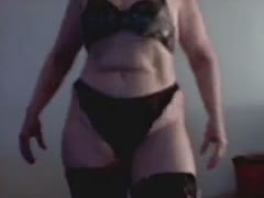 On livecam, a mature Latina beauty wearing dark underwear